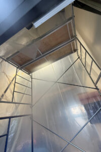 removing-batten-insulation-high-bay-shop